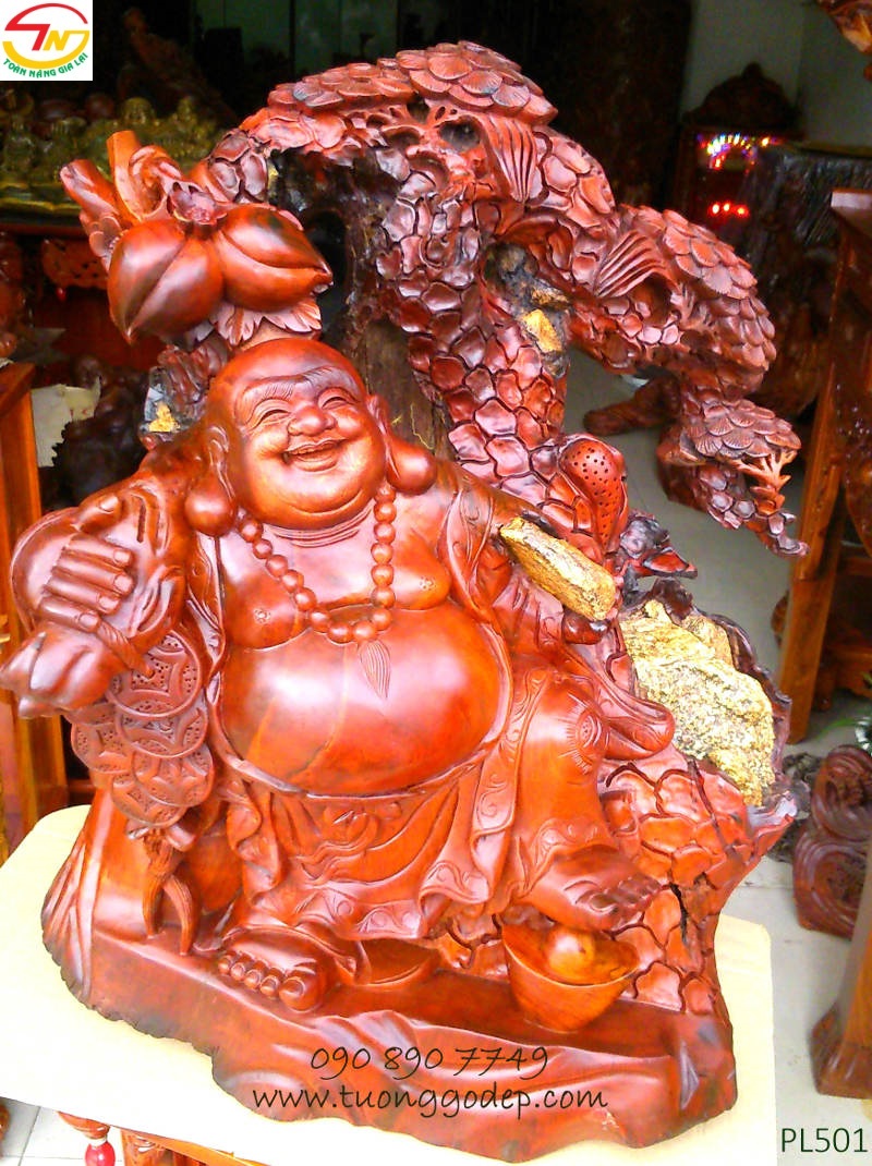 Phật Di Lặc gỗ hương ôm đá